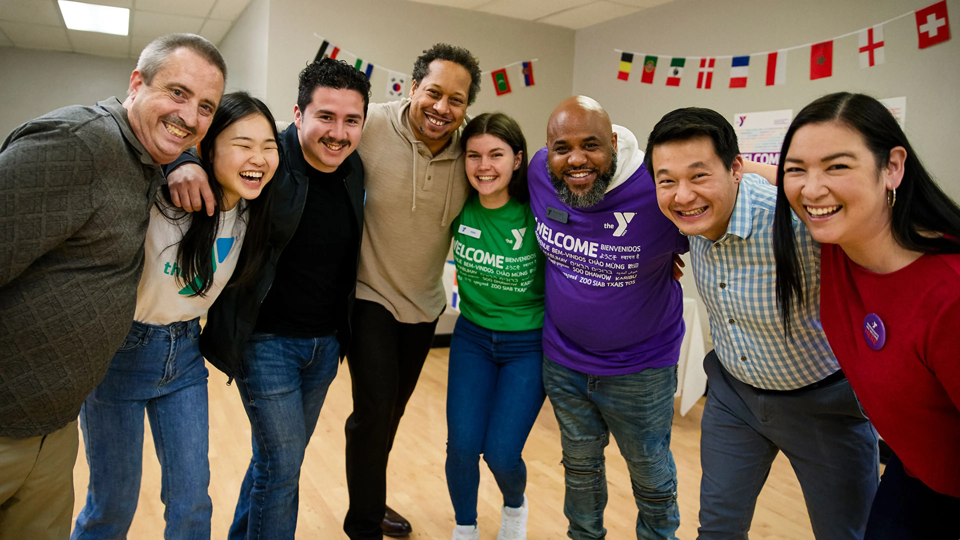 Group of volunteers gathered together for a group photo at a fundraising event